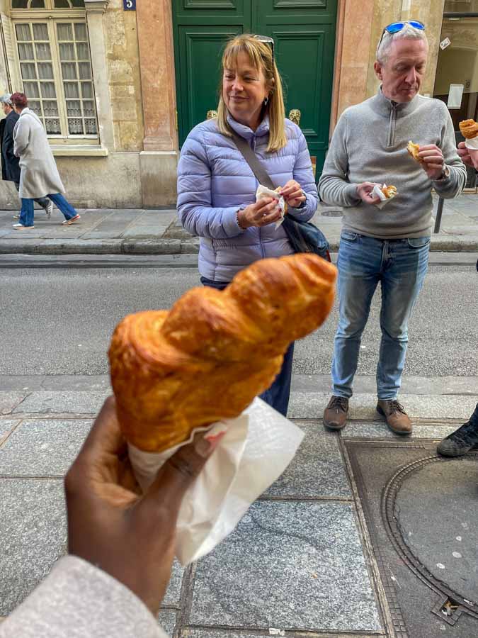 me holding a croissant