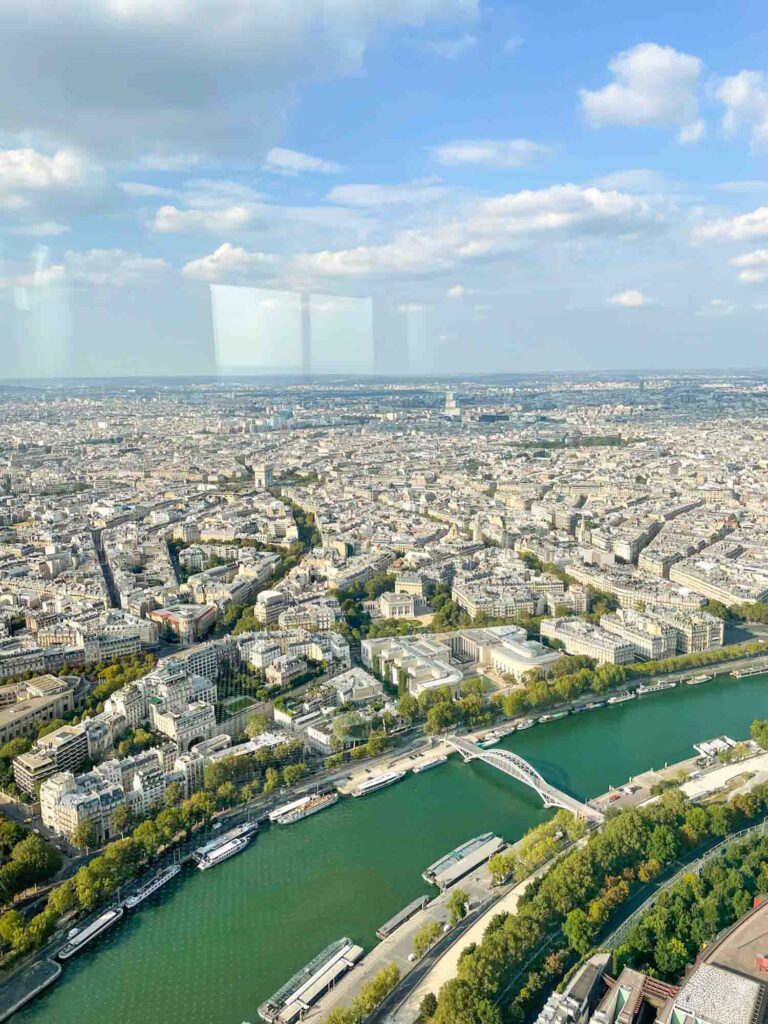 The view of Paris' buildings and the Seine from the Eiffel Tower