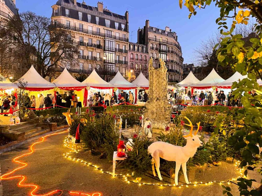 Shopping around at a Christmas market is one of the things to do when visiting paris in December.