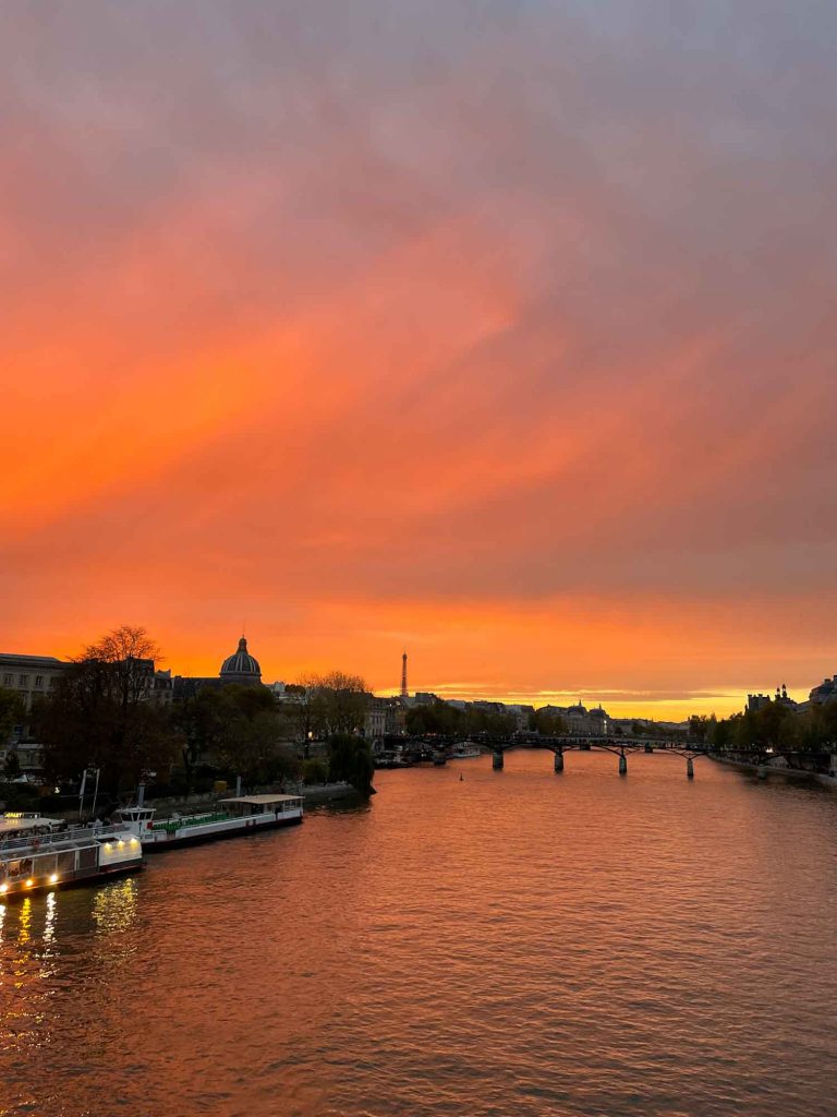 Watching a sunset is one of the best things to do in Paris on a honeymoon.