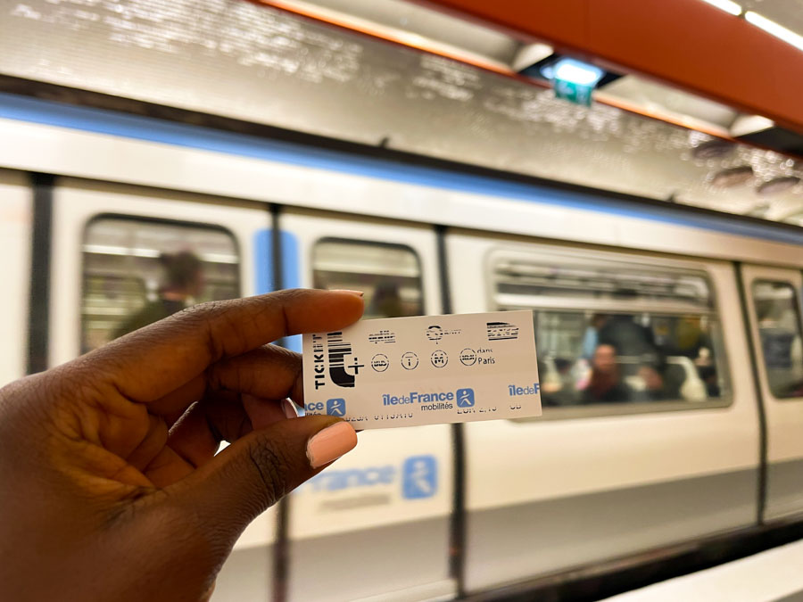 me holding the single use t+ ticket for the paris metro